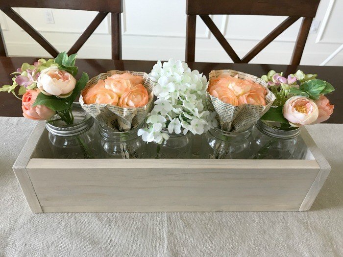 Make this quick and easy DIY 5 Mason Jar Planter Box for just $6.50. Makes great home decor, gifts, craft party projects, wedding centerpieces, and more. Can be sold at craft fairs and online too.