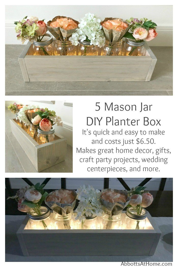 Make this quick and easy DIY 5 Mason Jar Planter Box for just $6.50. Makes great home decor, gifts, craft party projects, wedding centerpieces, and more. Can be sold at craft fairs and online too. #masonjar #diy #centerpiece