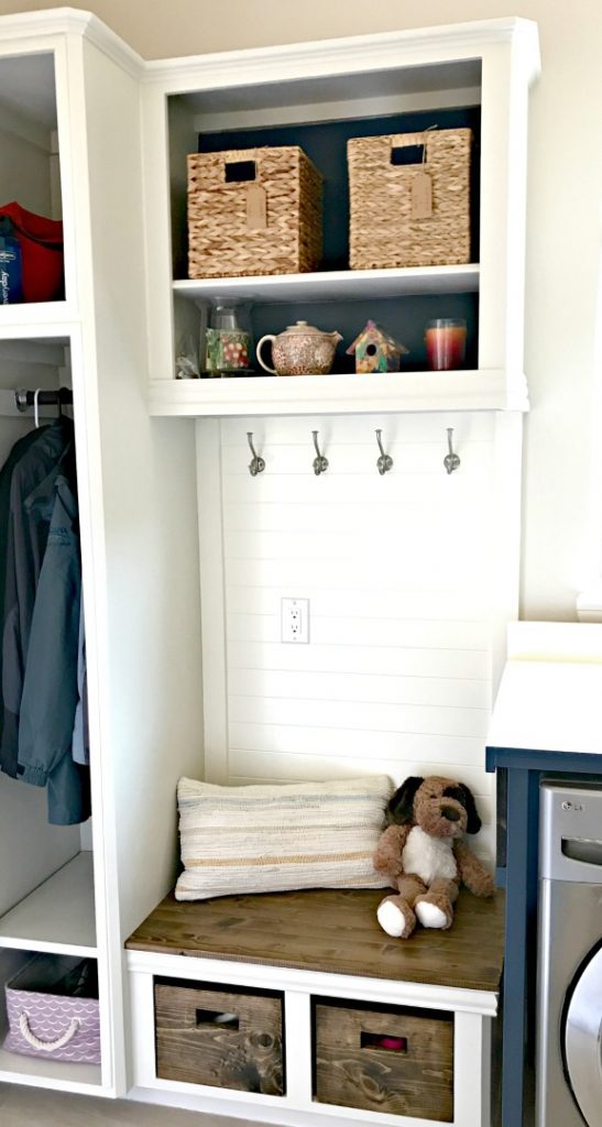 Looking for DIY Mudroom Ideas? You can upcycle your old cabinets into a beautiful and affordable DIY Laundry and Mudroom Combo. This cabinet update was less than $100. And the mudroom bench, coat, and shoe storage makes this space so much more functional!