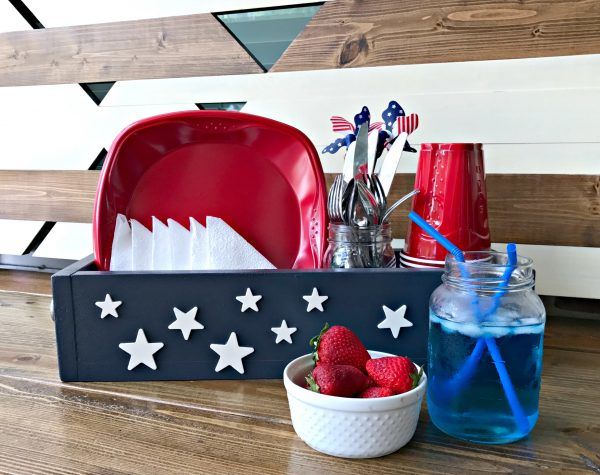 Make an Easy Patriotic Table DIY Utensil Caddy, just $7. Give those summer backyard BBQ's and beach picnics a patriotic touch with this American themed utensil caddy basket. Makes great home decor, gifts, craft party projects, centerpieces, and more. Can be sold at craft fairs and online too.