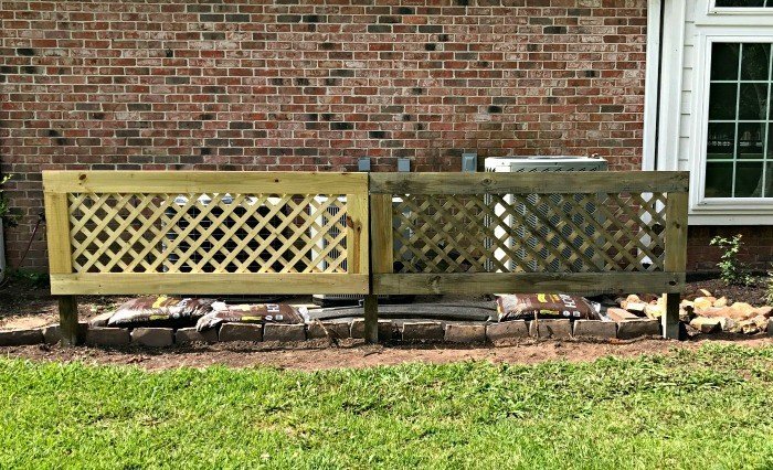 DIY Removable Outdoor Air Conditioner Screen. Hide those air conditioners, allow proper air flow for the condenser, and make the AC guy happy when he sees how easy it is to remove. You can easily have this project done in a weekend. #AbbottsAtHome #AirConditioner