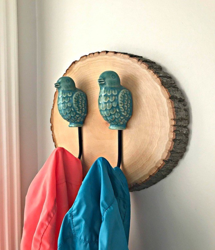 Here's a super easy wall decor idea using those beautiful wood slices. Here's how to make an Easy DIY Wood Slice Wall Hook, like mine! This craft makes a great gift too.#AbbottsAtHome #WallDecor #CraftIdeas #WoodSlice #DecorIdeas #CoatHooks #WallHooks