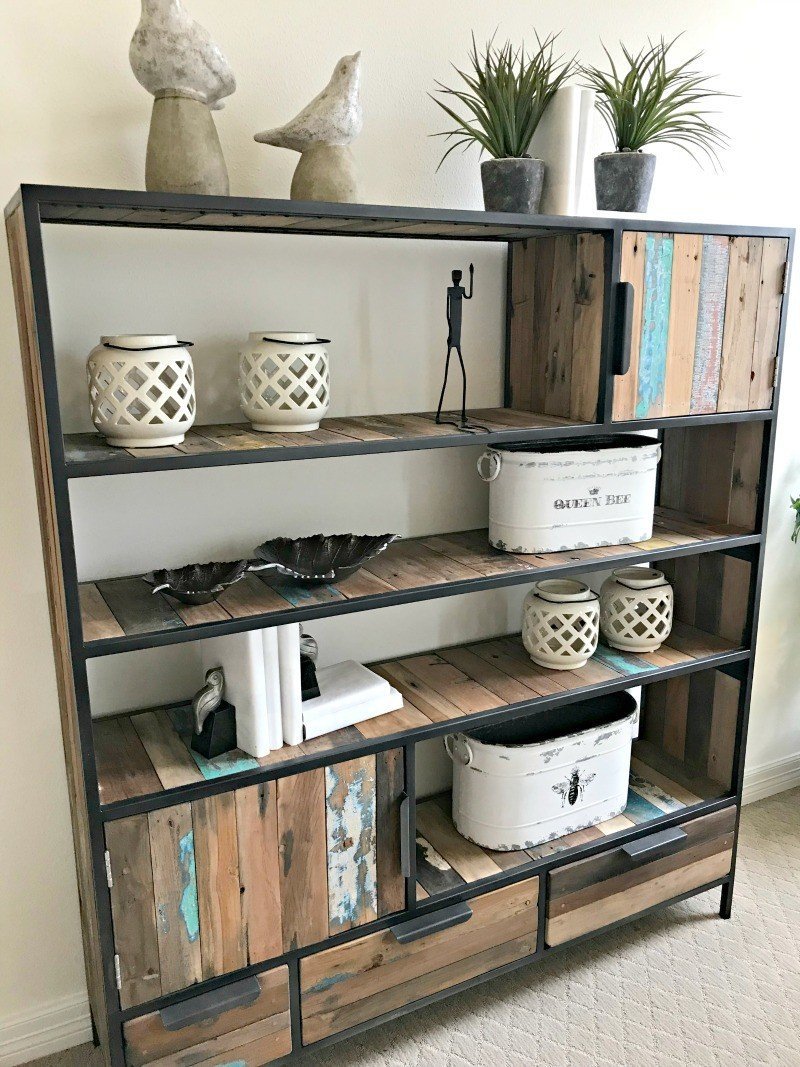 Chippy Paint Rustic Living Room Bookshelf Idea. Check out this photo tour from Model Homes with Beautiful Furniture and Home Interior Design Ideas that I love!