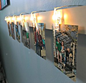 Quick and Easy DIY Light Clip Display Board. Fun way to display kid's art, photos, notes, and more.