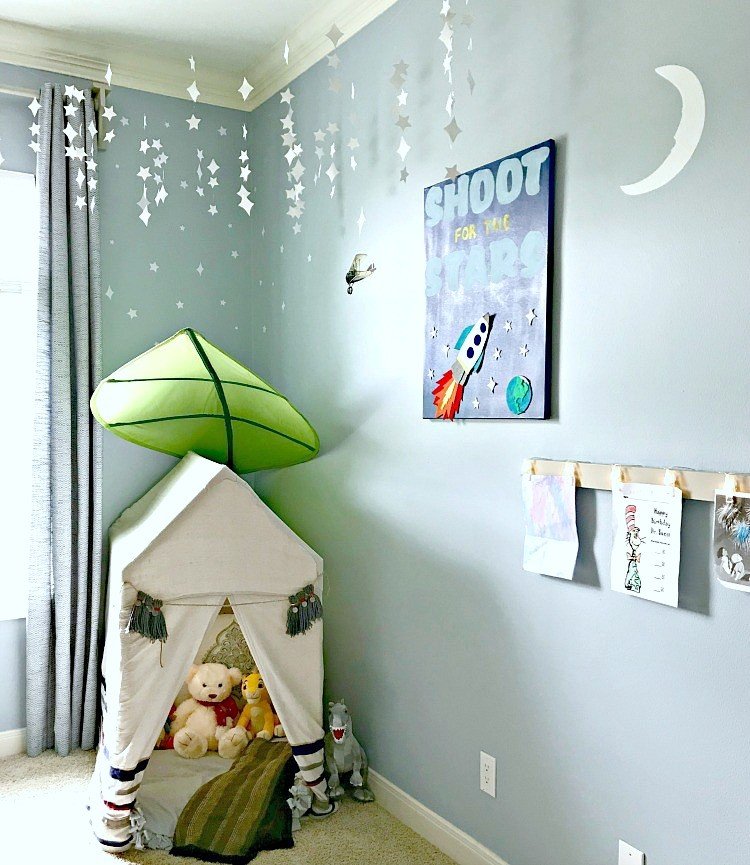 It's time for the boys bedroom makeover reveal, guys! And I'm so excited to share it with you. The whole room is full of awesome DIY projects, affordable decor, and fun boys bedroom ideas. I'm loving it and so are my boy's! This is a blue, white, and grey bedroom full of pops of fun colors. I think it's a bit Modern Farmhouse, a bit traditional, and a bit Land of Nod. I designed this for my boys, but most of the ideas would work for all kids, boys and girls. #kidsbedroom #kidsroom #boysbedroom