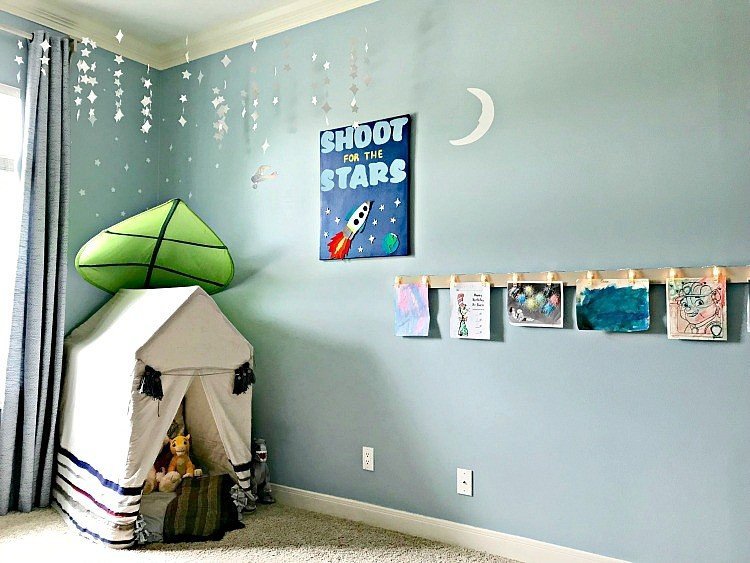 It's time for the boys bedroom makeover reveal, guys! And I'm so excited to share it with you. The whole room is full of awesome DIY projects, affordable decor, and fun boys bedroom ideas. I'm loving it and so are my boy's! This is a blue, white, and grey bedroom full of pops of fun colors. I think it's a bit Modern Farmhouse, a bit traditional, and a bit Land of Nod. I designed this for my boys, but most of the ideas would work for all kids, boys and girls. #kidsbedroom #kidsroom #boysbedroom