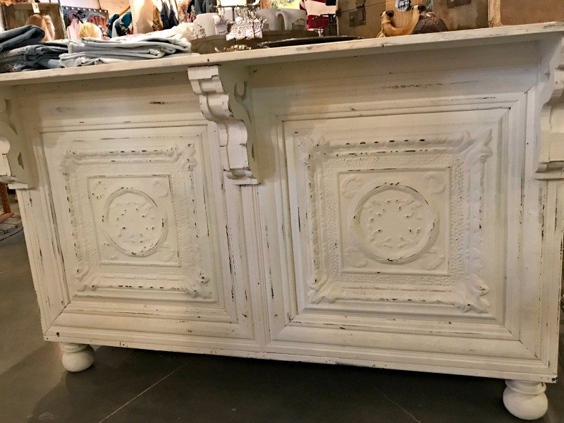 A white distressed bar front with tin tiles. A few more Round Top Shopping Trip Tips and some photos from the Junk Gypsy Headquarters. A shopping trip to Round Top and Waco would make a perfect weekend, guys! #AbbottsAtHome #RoundTopTexas #JunkGypsy #GirlsWeekend