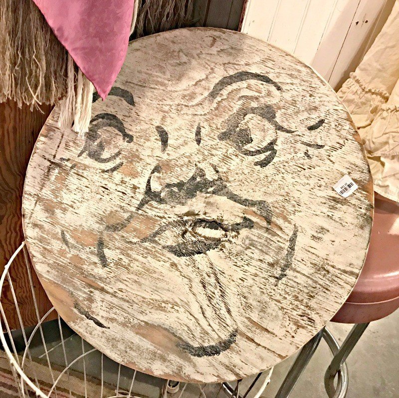 A round moon face with distressed paint. A few more Round Top Shopping Trip Tips and some photos from the Junk Gypsy Headquarters. A shopping trip to Round Top and Waco would make a perfect weekend, guys! #AbbottsAtHome #RoundTopTexas #JunkGypsy #GirlsWeekend