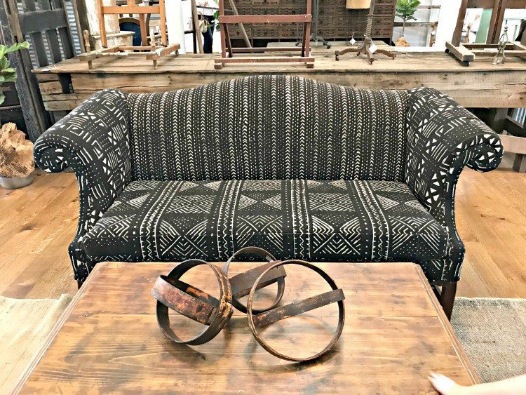Black and white tribal prints on a small love seat or couch. The Spring and Fall Round Top Texas Antiques and Flea Markets are great! BUT you can find Fun, Art & Furniture Shopping in Round Top, Texas year round, guys! Check out photos from the shops in town. #RoundTop #TexasTravel #AbbottsAtHome