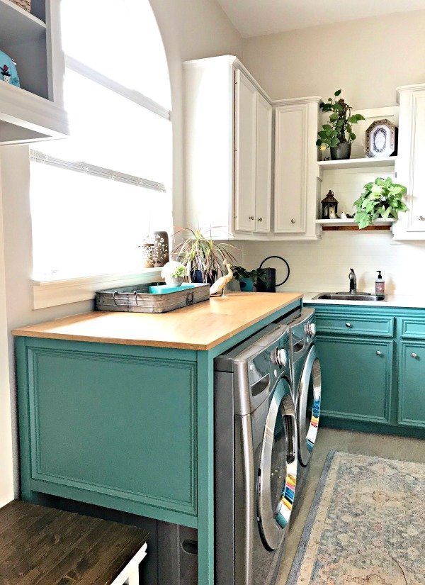 Our White and Teal Colorful Laundry Room Makeover is done! You won't believe the Laundry Room Before and After photos. This Colorful Modern Farmhouse Laundry Room makeover uses teal, wood, and lots of white to freshen and lighten the whole space. #LaundryRoom #ModernFarmhouse #Teal #AbbottsAtHome