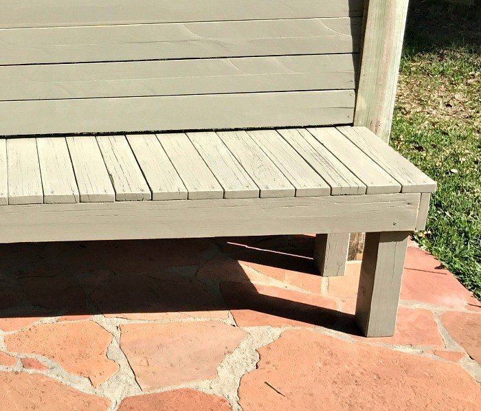 Build this DIY Rustic Farmhouse Outdoor Bench with just a drill and a saw. This is a great 2x4 bench project. #AbbottsAtHome #DIYBench #DIYFurniture #2x4bench