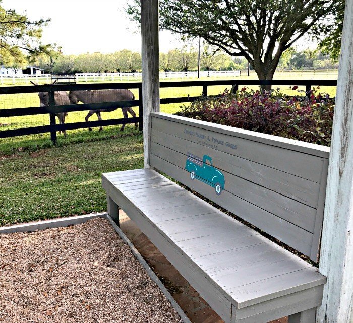 Build this DIY Rustic Farmhouse Outdoor Bench with just a drill and a saw. This is a great 2x4 bench project. #AbbottsAtHome #DIYBench #DIYFurniture #2x4bench