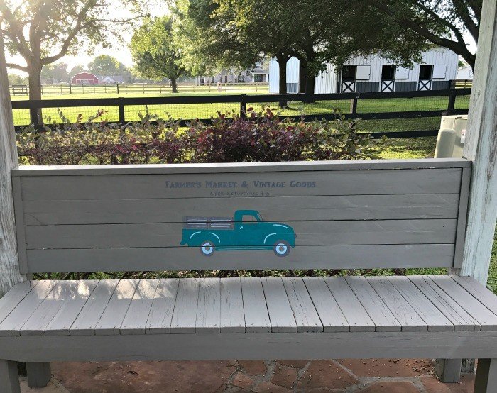 A grey rustic, scrap wood 2x4 bench. Build this DIY Rustic Farmhouse Outdoor Bench with just a drill and a saw. This is a great 2x4 bench project. #AbbottsAtHome #DIYBench #DIYFurniture #2x4bench