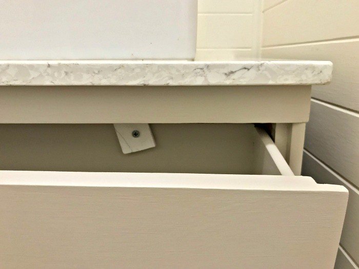 If you're wondering how to convert that dresser into a vanity, I've got some tips for converting a dresser into a vanity. And how-to steps to cut and modify the vanity drawers for plumbing. #AbbottsAtHome #DIYVanity #BathroomVanity #BathroomIdeas