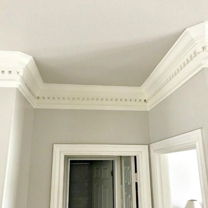 7 before & after examples showing how a Light Paint Color on Walls and Ceilings has made every room feel light, bright, and more open. Walls and upper cabinets painted in Behr's Sandstone Cove in Eggshell Sheen. White Trim Painted with Behr's Polished Pearl in Eggshell Sheen.