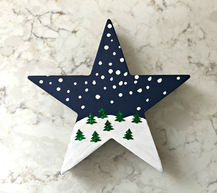 Snowy Landscape Ornament. Need some new ideas for this years Christmas craft? I've got 12 fun and easy handmade Christmas Ornament Ideas for you! Make 3D scrapbook paper trees, pom pom trees, star string art, unicorn stars, and more. #AbbottsAtHome #Handmade #ChristmasCrafts #ChristmasIdeas #ChristmasOrnaments