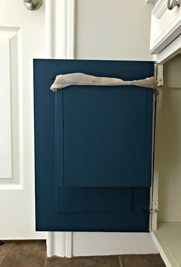 You can hide that bathroom garbage away when you build your own custom DIY Cabinet Door Mounted Garbage Can. This a quick and easy DIY win! #AbbottsAtHome #BathroomStorage #BathroomIdeas #DIYIdeas