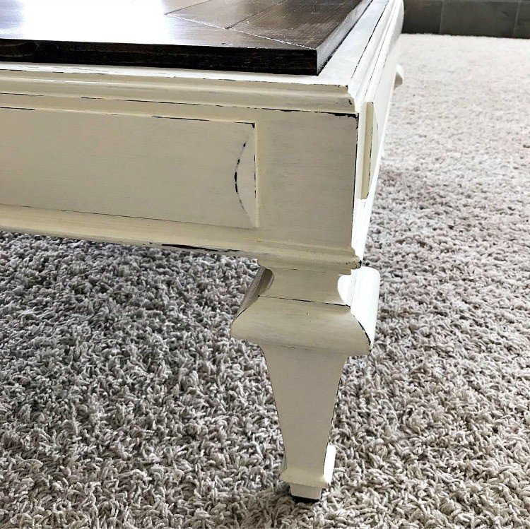 Table Leg with dark stain base, painted over with white paint, then distressed. #AbbottsAtHome