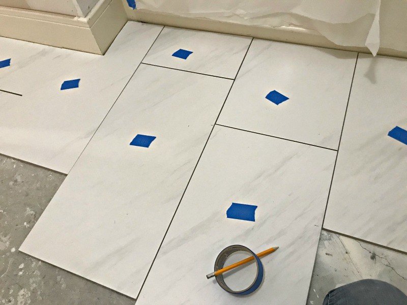 DIYers can save time installing tile if you cut them and lay them out in batches. Here are my DIY Tips for Installing Floor Tile Faster and Better. #AbbottsAtHome #InstallingTile #TileInstall #Tiling #LayingTile #DIYTile
