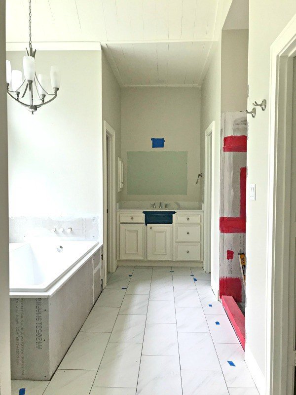 I'm loving this Marble Look Porcelain Tile, guys. The 12x24 size looks beautiful. The non-slip matte finish is pretty and perfect for a bathroom. And the grey marble veining is so subtle. I can't believe how cheap it was! Here are my DIY Tips for Installing Floor Tile Faster and Better. #AbbottsAtHome #MarbleLook #MarbleFloor #PorcelainTile #BathroomTile