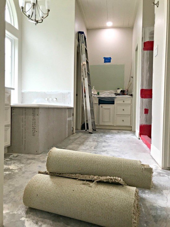 Prepping the floor before laying tile is an important first step, you shouldn't mess up! Here are my DIY Tips for Installing Floor Tile Faster and Better. #AbbottsAtHome #DIYTile #DIYBathroom #BathroomRemodel