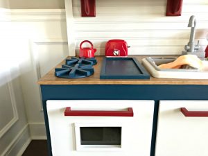 Yay! This Kids Play Kitchen DIY Woodworking Plan is an easy woodworking build with lots of fun additions that little kids will love! I have the tutorial, printable plans, and a video to help you get this built. #AbbottsAtHome #KidsKitchen #PlayKitchen #KidsKitchen #KidsFurniture #woodworking