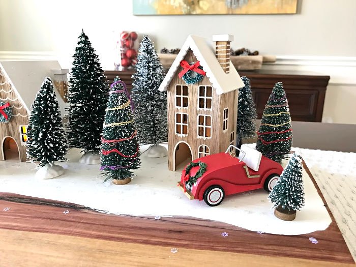 Here's how to make an Easy Farmhouse DIY Red Truck Christmas Table Centerpiece your guests will love. With DIY steps and how to video. #AbbottsAtHome #RedTruck #Christmas #ChristmasCrafts #ChristmasTable