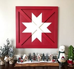 How to build this Wooden DIY Barn Star Art (Wood Barn Quilt) for less than $20 in lumber. Pottery Barn sells it for $400. Winning! DIY Wood Sign - Barn Quilt - Pottery Barn Knock Off #ChristmasProjects #ChristmasDecor #ChristmasSign #PotteryBarn #BarnQuilt #AbbottsAtHome